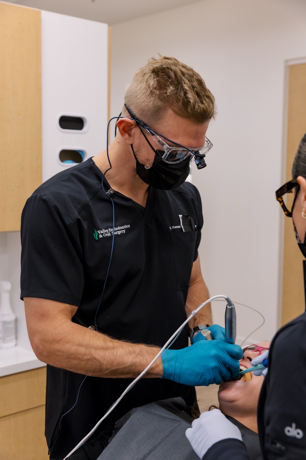 An oral surgeon performing a procedure at a partner dental practice